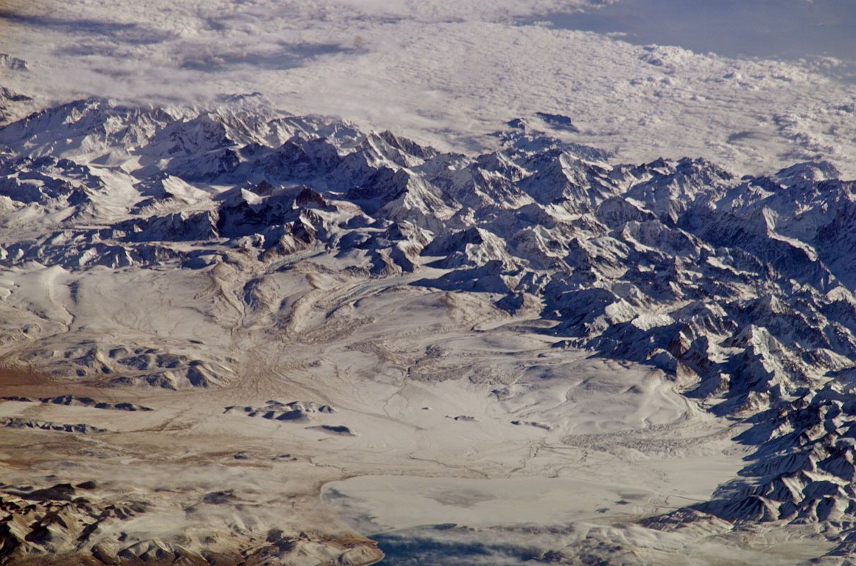 Shishapangma 02 04 Nasa ISS008-E-13316 Low Angle From East Nasa ISS008-E-13316 was taken on 2004-01-28 from the east. This is a superb lower angle image of Shishapangma and the surrounding mountains, with Peiku Tso in the lower right. Shishapangma is the mountain with what looks like a dark triangular rock face vertically in the centre and horizontally just to the left of centre, with Phola Ganchen (7661m) on the ridge to the left.